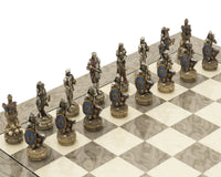 The Zombie and Grey Ash Deluxe Chess Set pieces on an intricately detailed glossy grey ash burl board.